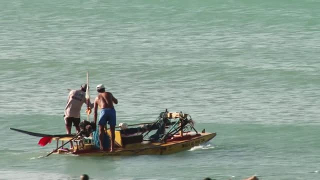 Fishermen drive boats to fish in the sea