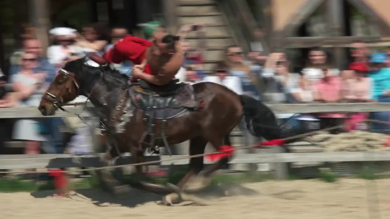 Cossack horseman doing tricks on galloping horse. Kievan Rus park