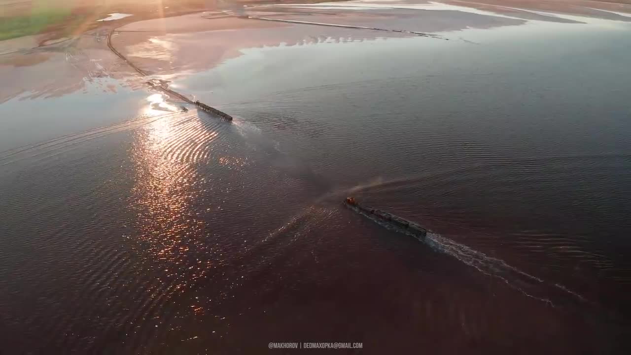 Train running on water. Pink lakes. Bursol