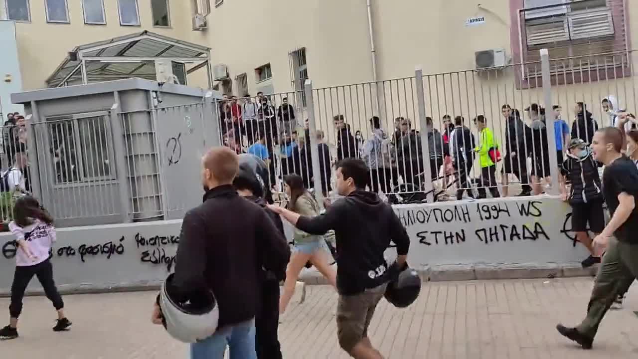 A large group of antifa protesters gathered outside a school in Thessaloniki, Greece