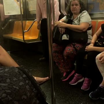 Asian guy pink shirt glasses wiggling subway dance