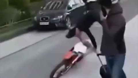 Falls off the bike