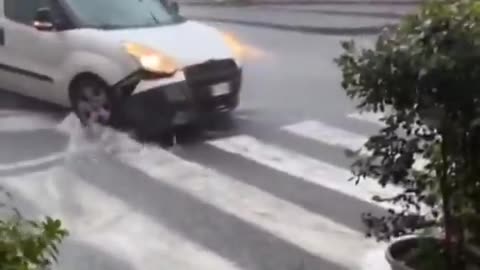 Massive floods due to torrential rains on the street in Acireale of Sicily region, Italy