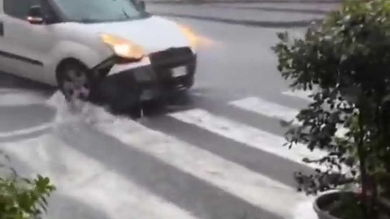 Massive floods due to torrential rains on the street in Acireale of Sicily region, Italy