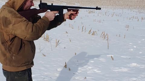 Firing the Thompson Sub-machine Gun