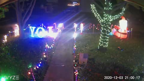 Car Drives Through Christmas Display