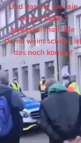 A WOMAN EATING AN APPLE ON A STOOP AND LOCKDOWN RULES IN GERMANY