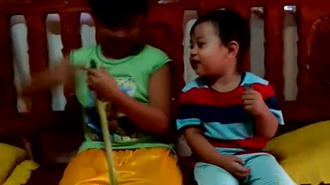 Baby laughs at the sound of a homemade trumpet