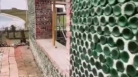 A HOUSE BUILT FROM GLASS BOTTLES