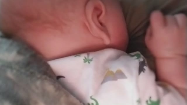 Dad and baby in bedroom nap time turns into breastfeeding attempt