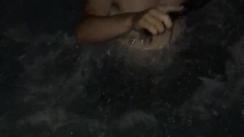 Guy drops gun into pool guy takes off shirt and goes in to get it out