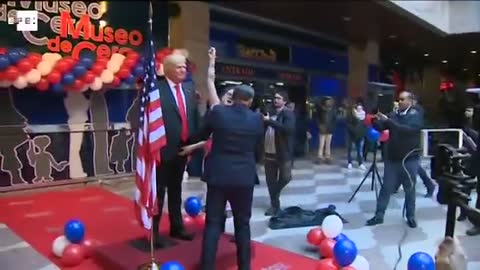 Feminist activist flashes breasts as protest against Trump in Madrid