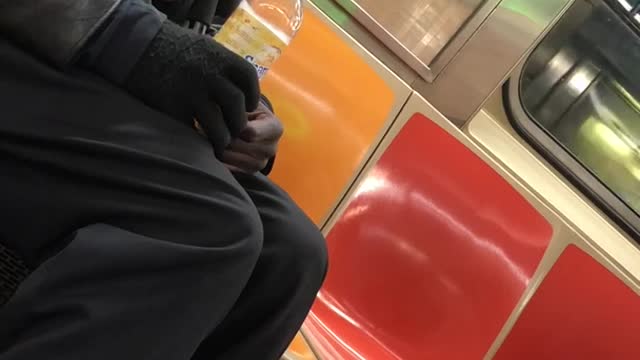 Man tries to hit on woman on subway train and she quickly gets out on her stop