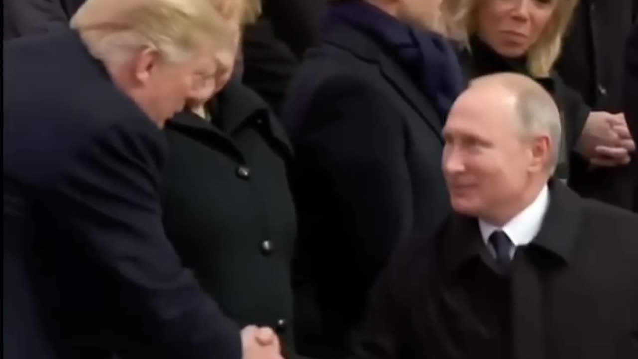 Trump and Putin shake hands