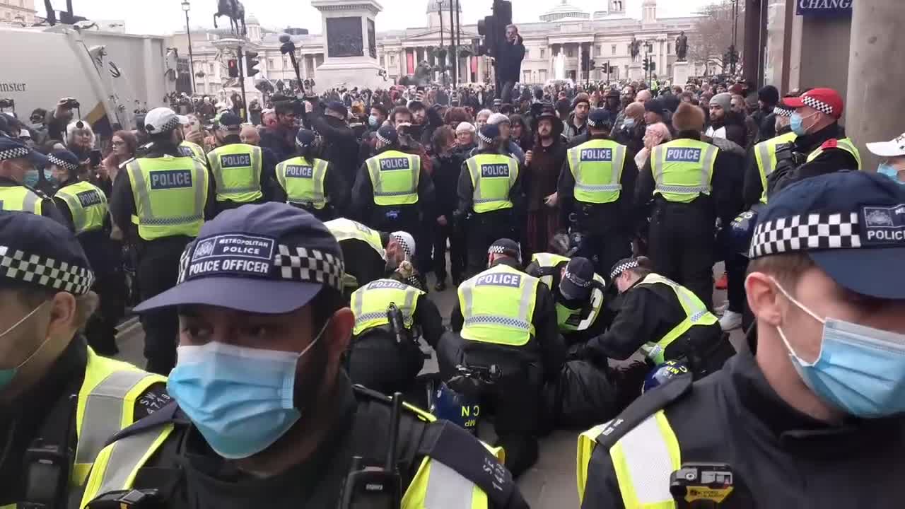 POLICE IN LARGE NUMBERS ARRESTING ONE MAN WORLD WIDE FREEDOM RALLY TRAFALGER SQUARE LONDON