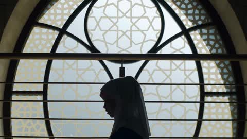 a-silhouette-of-a-girl-praying-and-reading-the-quran