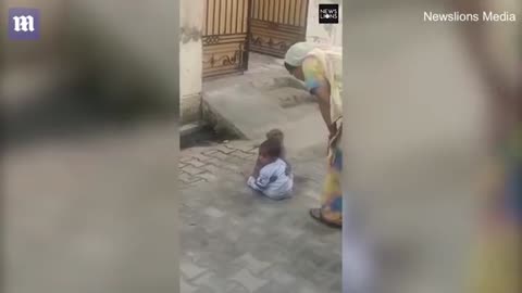 Monkey force a baby to play after kidnapping