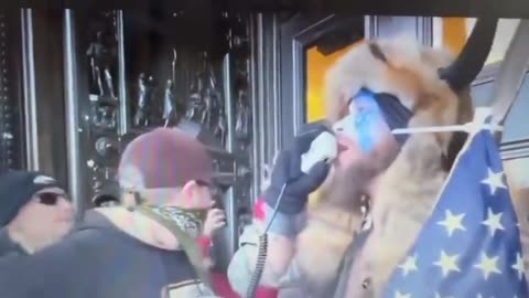 Hidden from Public: Q Shaman Stands Outside Doors of US Capitol and Tells Everyone to Go Home