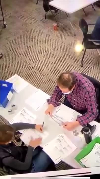 WATCH: Woman inside polling area filling out BLANK BALLOTS for over an hour!