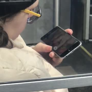 Woman watches nasty pedicure video on her phone