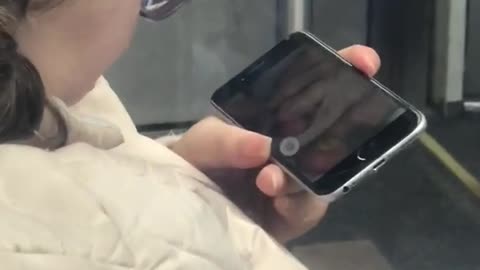 Woman watches nasty pedicure video on her phone