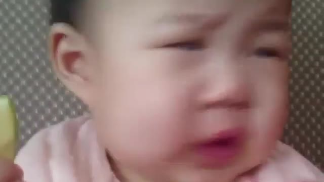 Baby reaction on tasting lemon