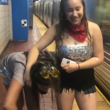 Two drunk girls one almost falls onto moving subway train