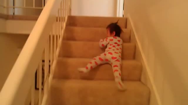 13 months old baby sliding down stairs