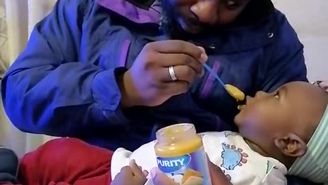 When man feeding his son