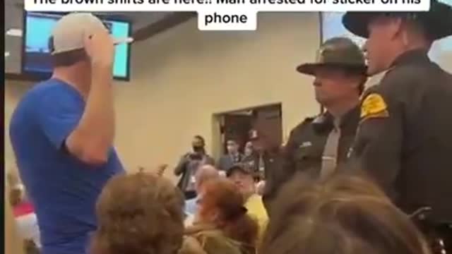 Man in Utah Arrested for Wearing We The People Shirt and Sticker on his Phone!