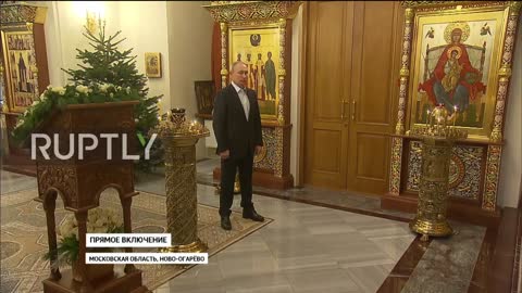 Putin attending church and praying to Mary