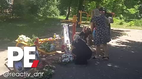 Bringing flowers and toys to the place of death by auf shelling of 8-year-old Vladik