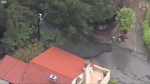 Mud and boulders slide down California hills - aerial video