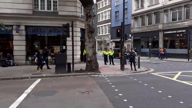 muslim and Jewish men argue on london streets of london