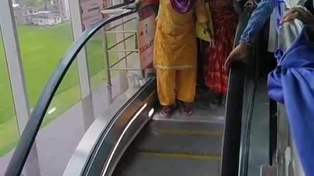 Funny moments when mothers are afraid to use the escalator stairs.