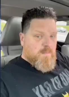 Three police officers approaching him