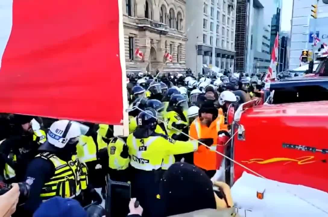 Canadian Police Push Peaceful Protester in the Snow