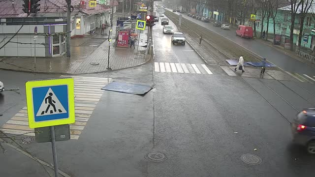 Strong Winds Send Roof into the Road