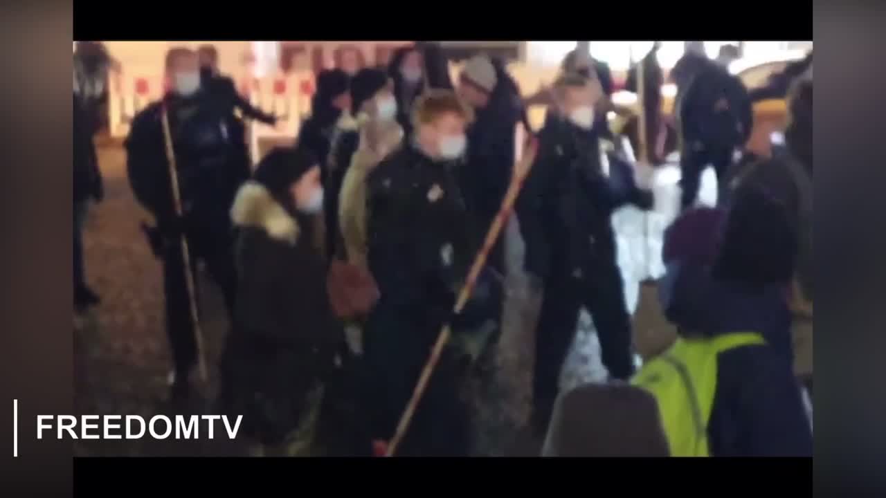 Moving the sheep along with their shepherd sticks