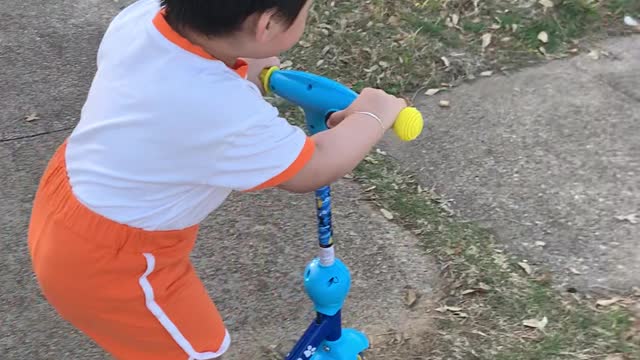 talent boy drives scooter