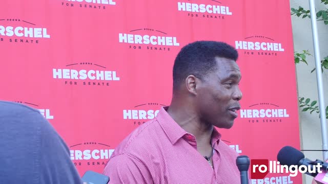 Herschel Walker speaks with the media at 2022 Juneteenth event