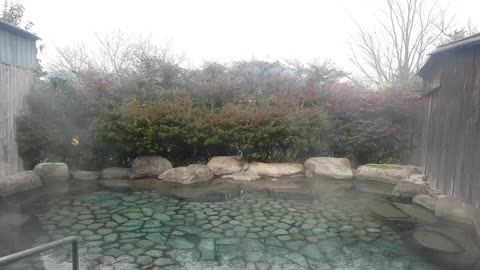 Smoke is coming up. Warm hot spring.