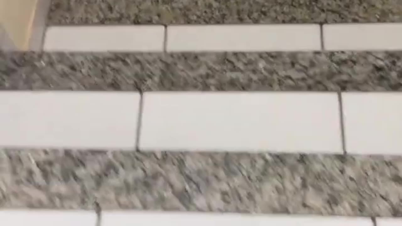 Sliding bottles over stairs