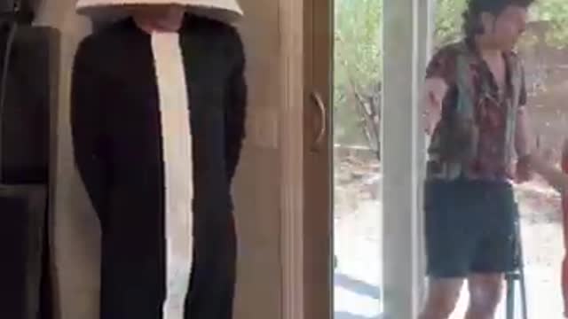 Man dressed as a lamp scares his friend