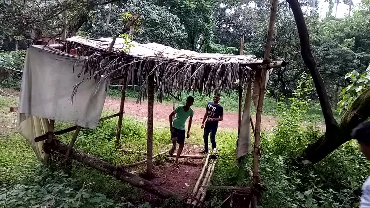 White shirt boy hits pole down from shack and it hits groin