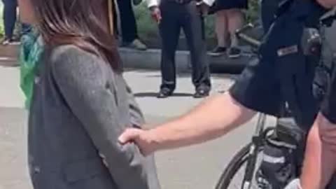 AOC Tries To Trick Crowd Into Thinking She's Handcuffed