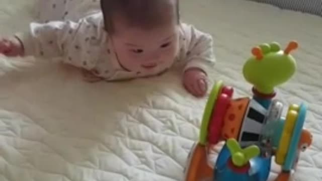 Baby looking at toys