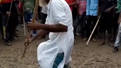 Super Indian lathi khel with old man. Very strong.