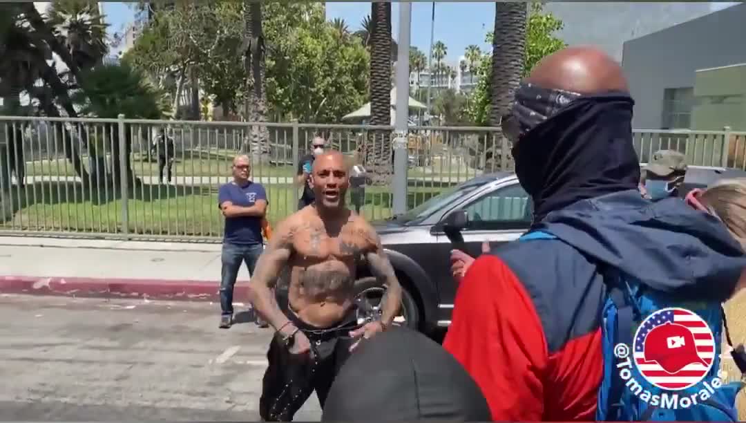 Man smacks an antifa in the face with a rosary