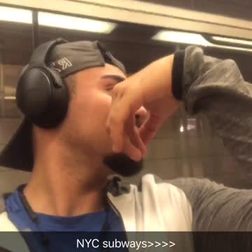 Man in blue shirt headphones records person yelling